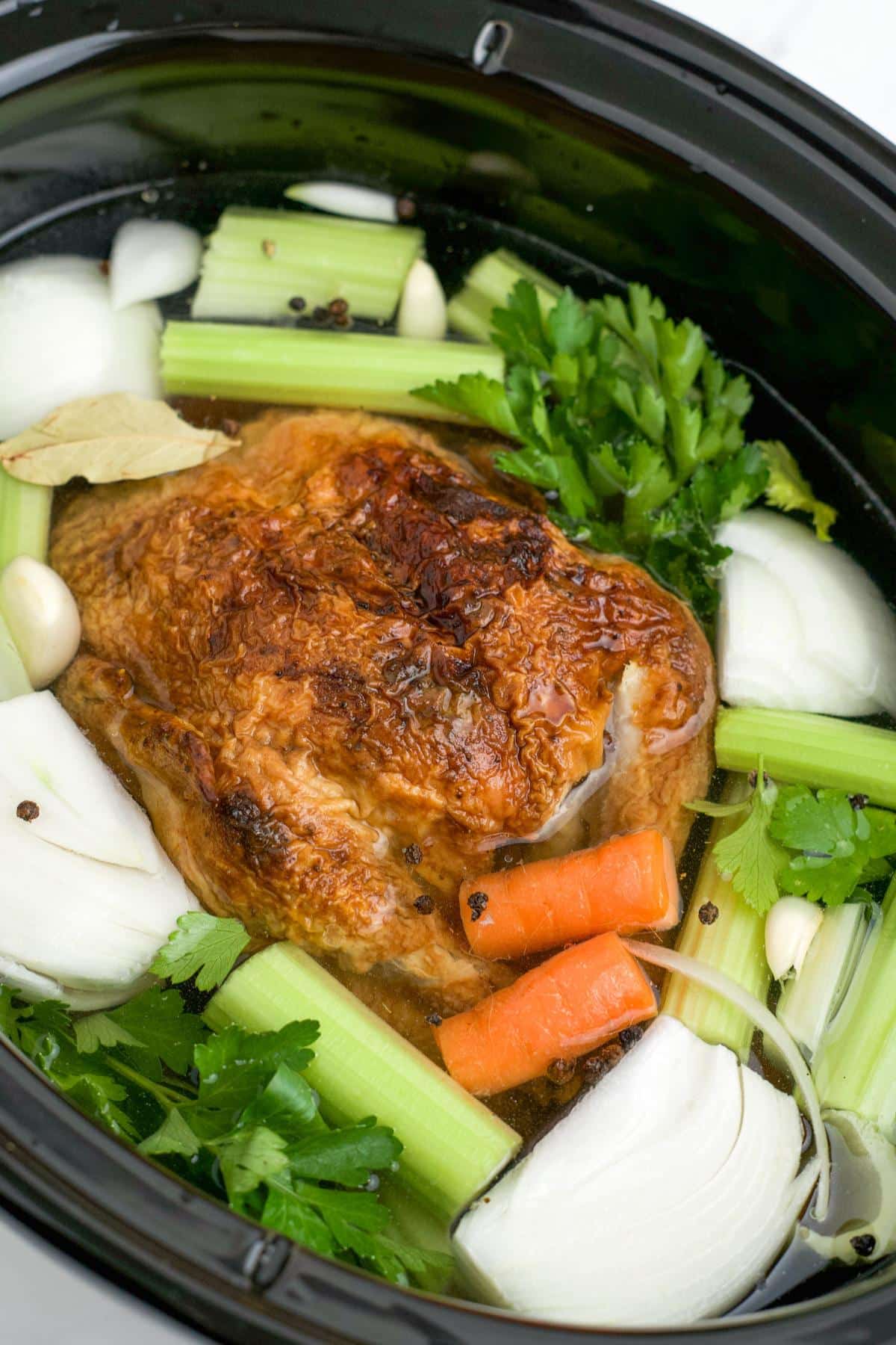 Rotisserie chicken and vegetables in the slow cooker to cook.