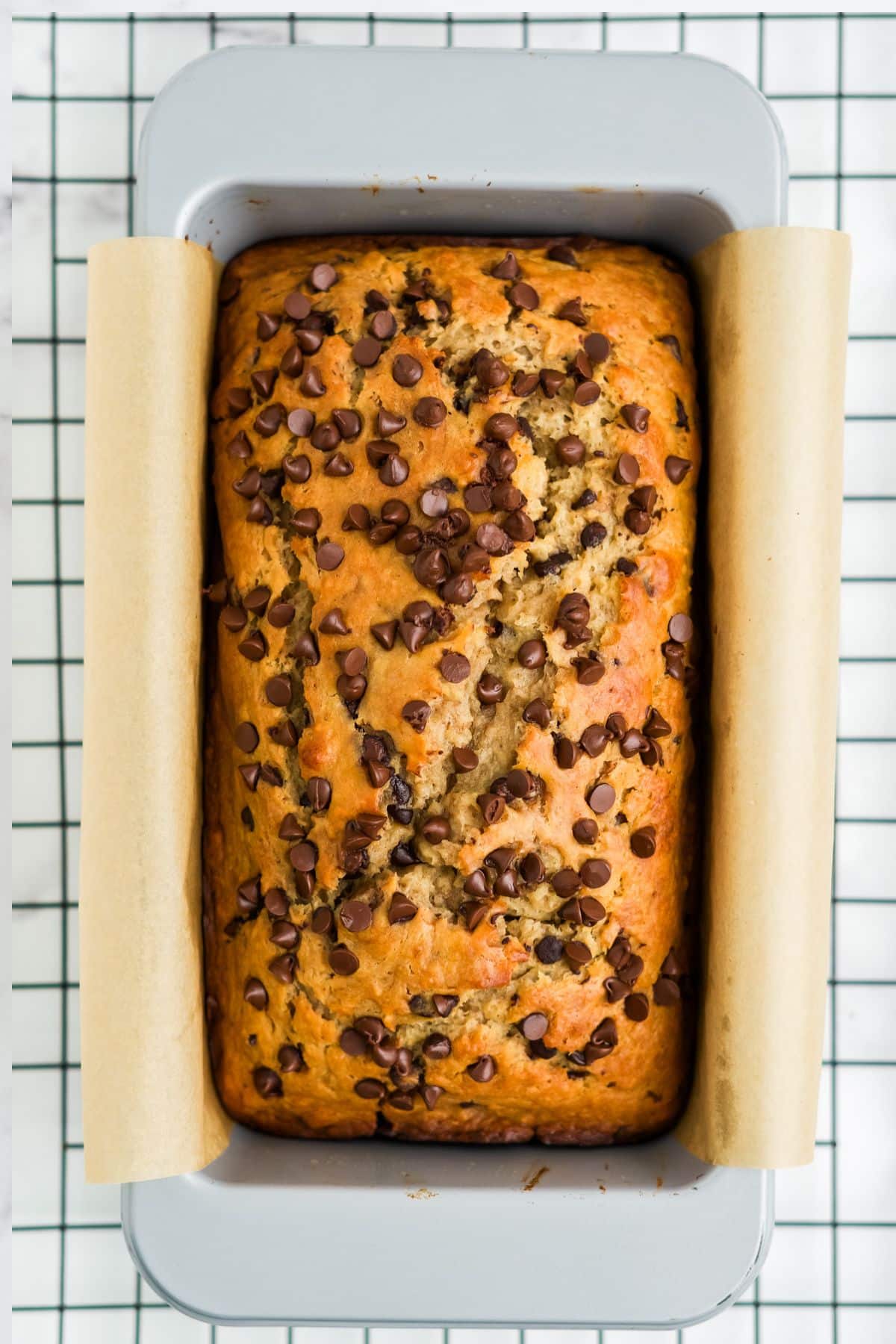 Banana bread with cottage cheese after baking on a wire rack still in the pan.