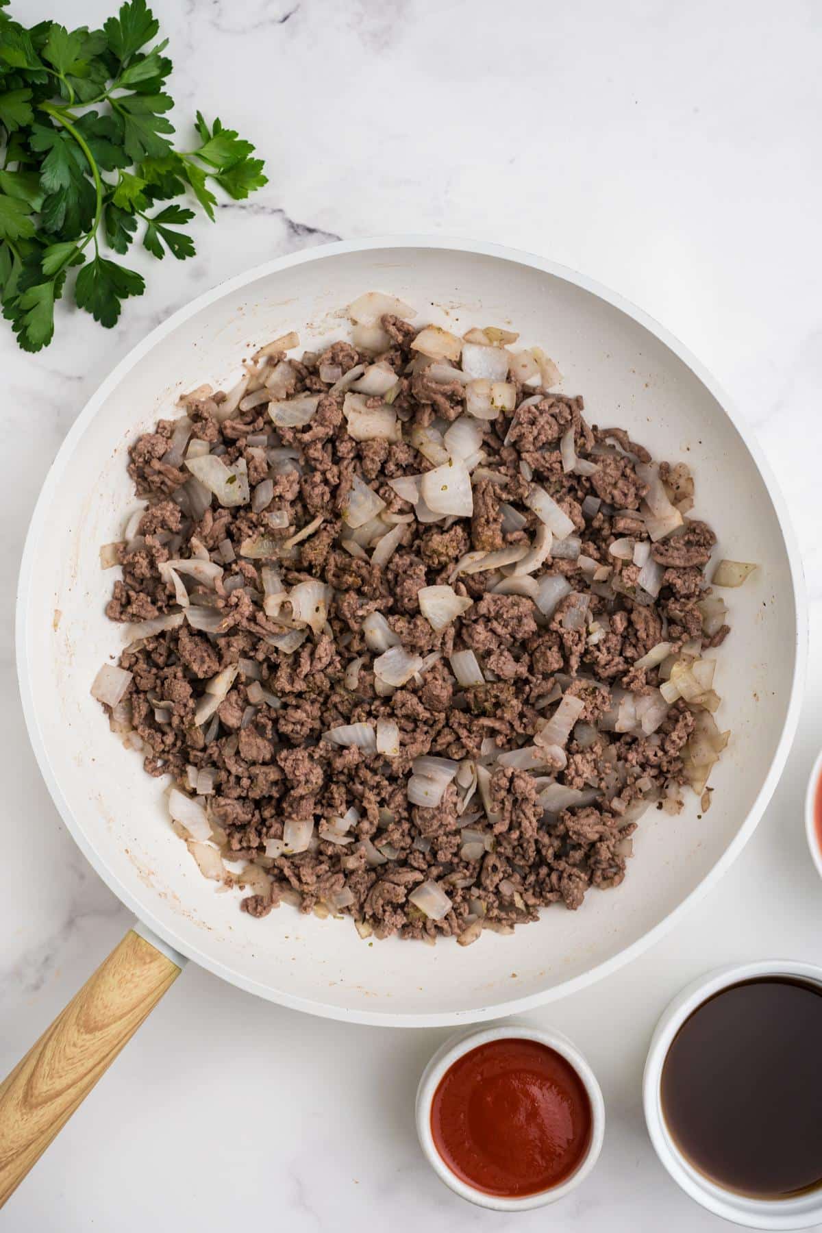 Ground beef cooked in a skillet.