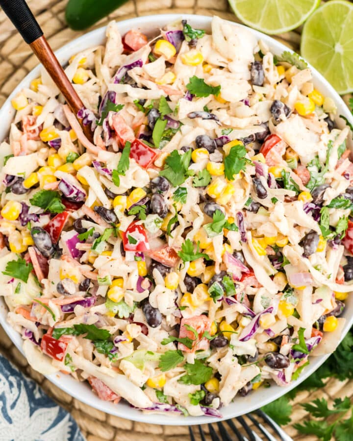 An overhead image of southwestern style coleslaw in a white bowl.