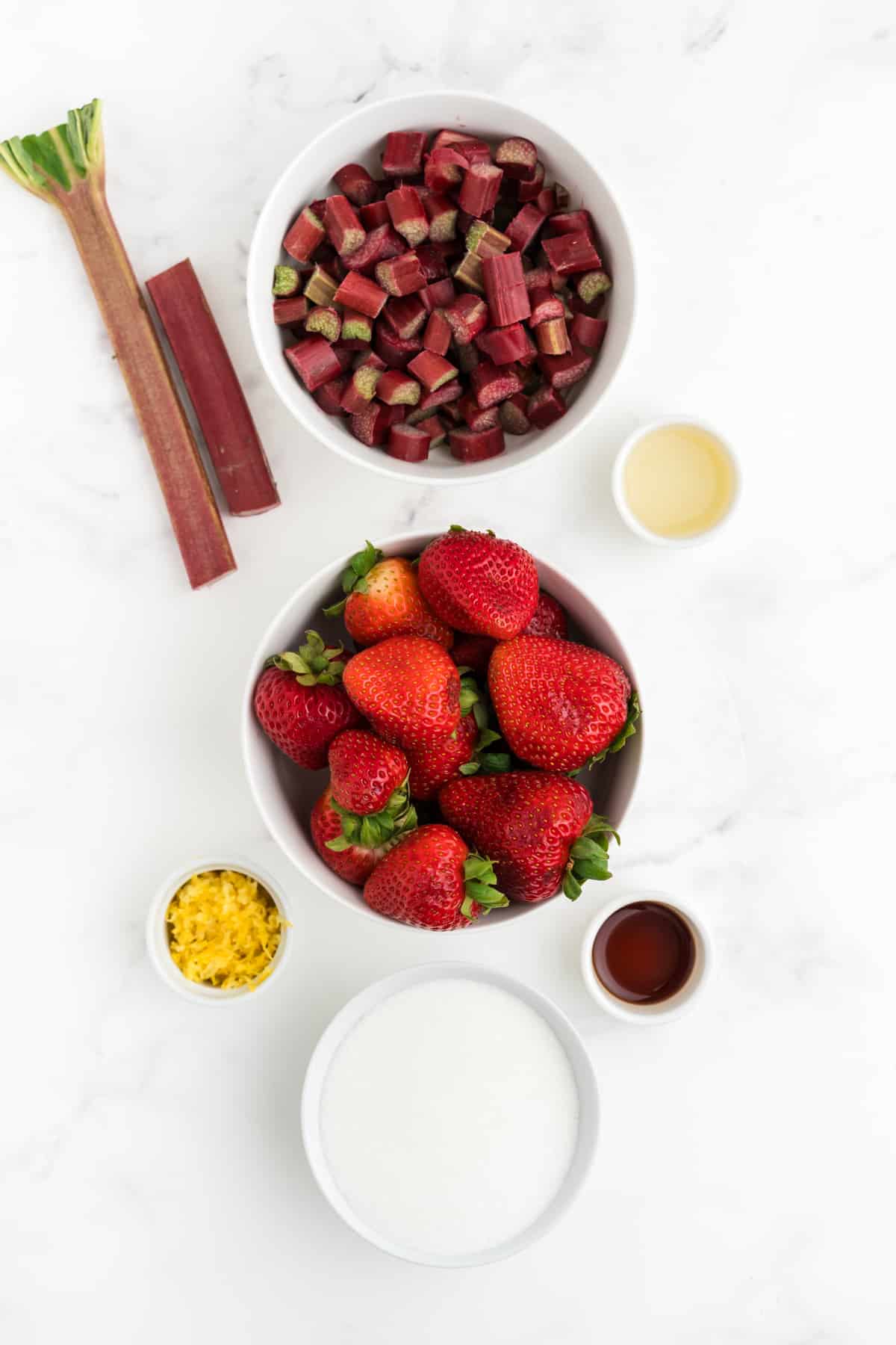 Image of ingredients for strawberry rhubarb preserves.