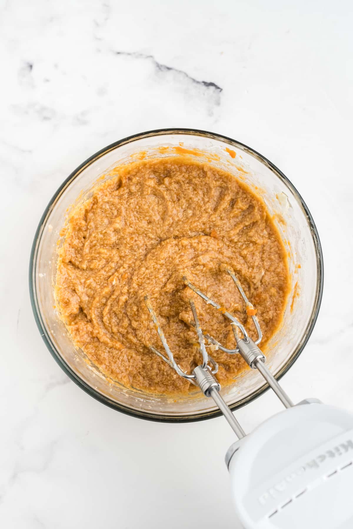 Pumpkin, egg and vanilla are added to brown sugar and butter mixture. 