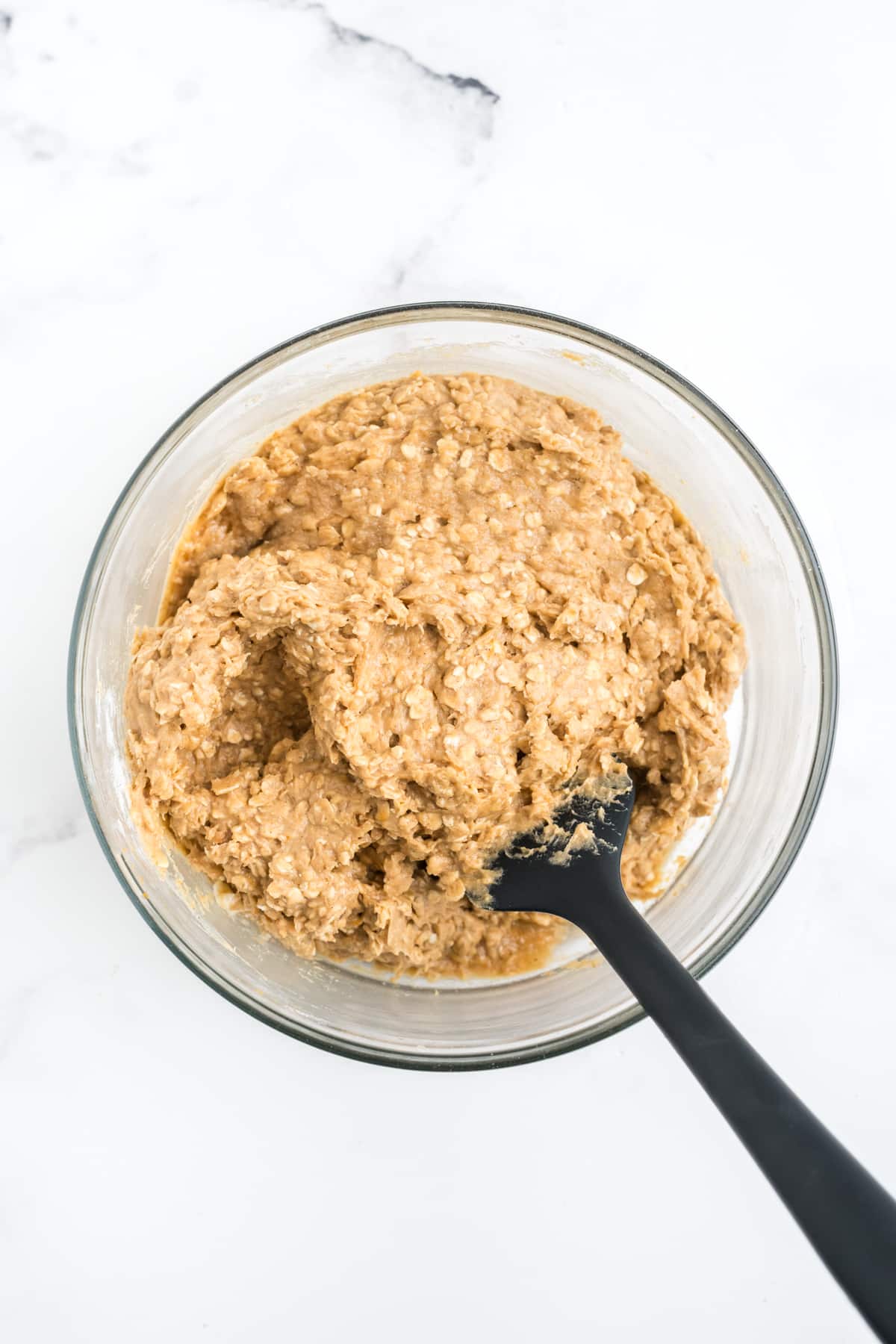 Final batter in a bowl for pumpkin oatmeal cookies. 