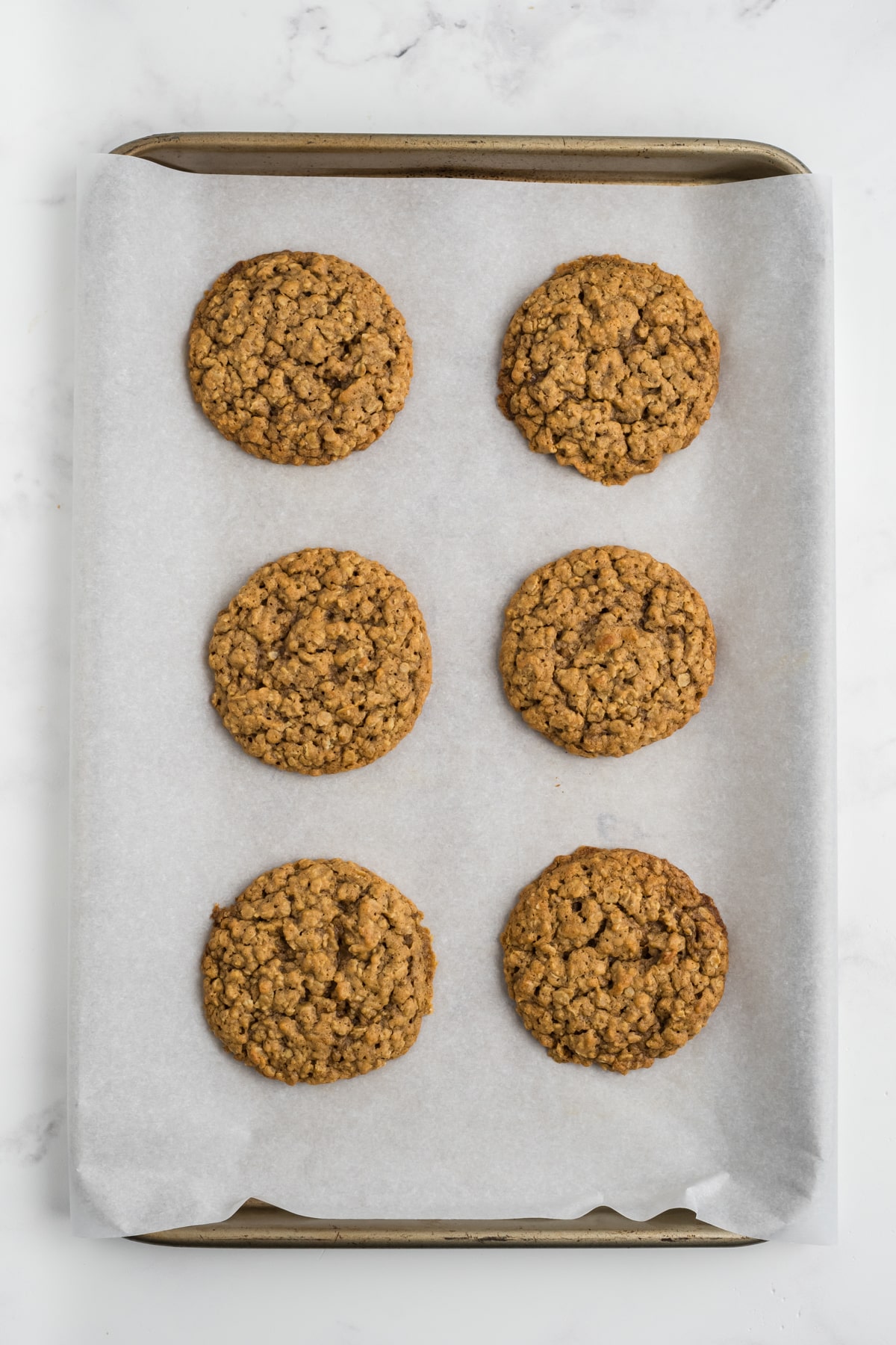 Pumpkin Oatmeal Cookies on a baking sheet after baking. 