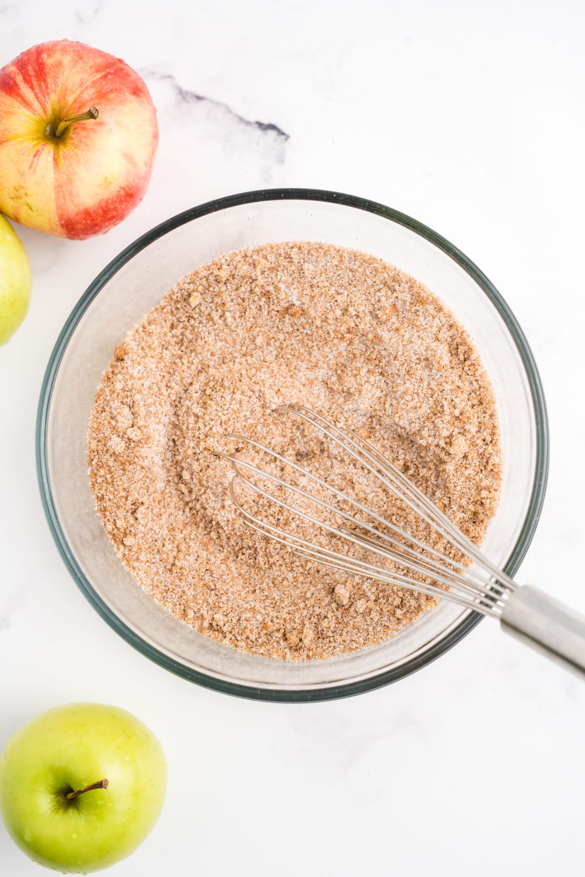 cinnamon and sugar being whisked in a bowl