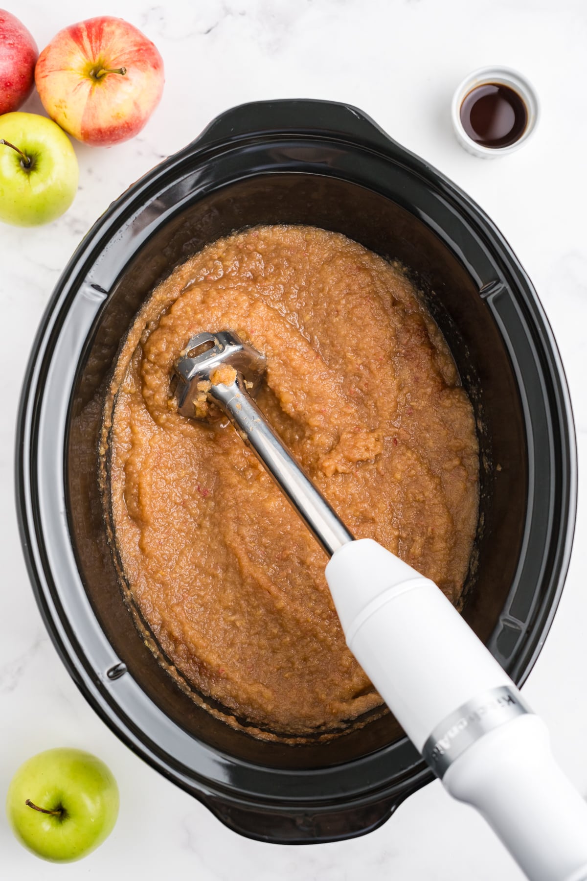 apple butter being pureed in the crockpot