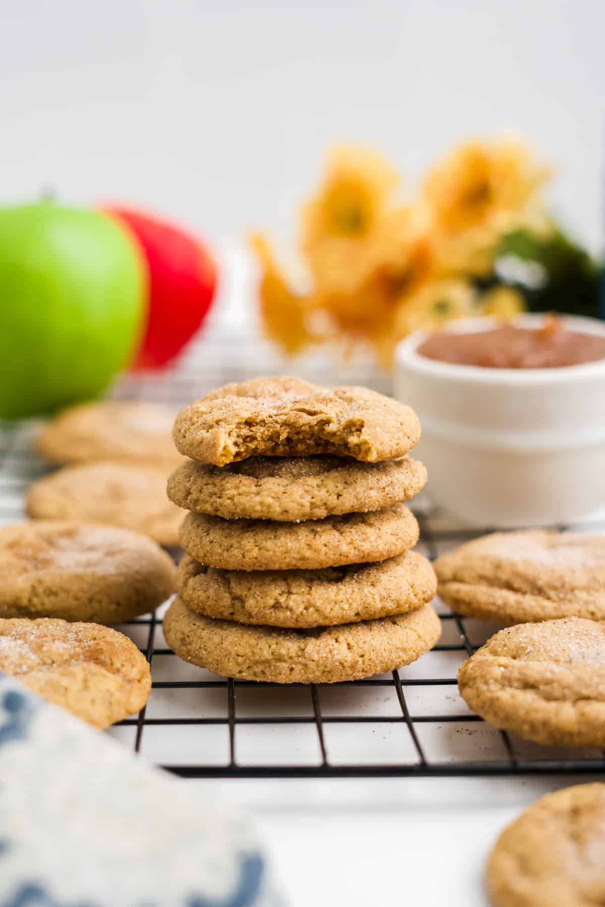 a stack of apple butter cookies on a cooling rack
