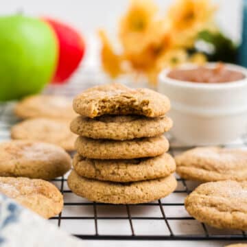 stacked apple butter cookies on a cooling rack