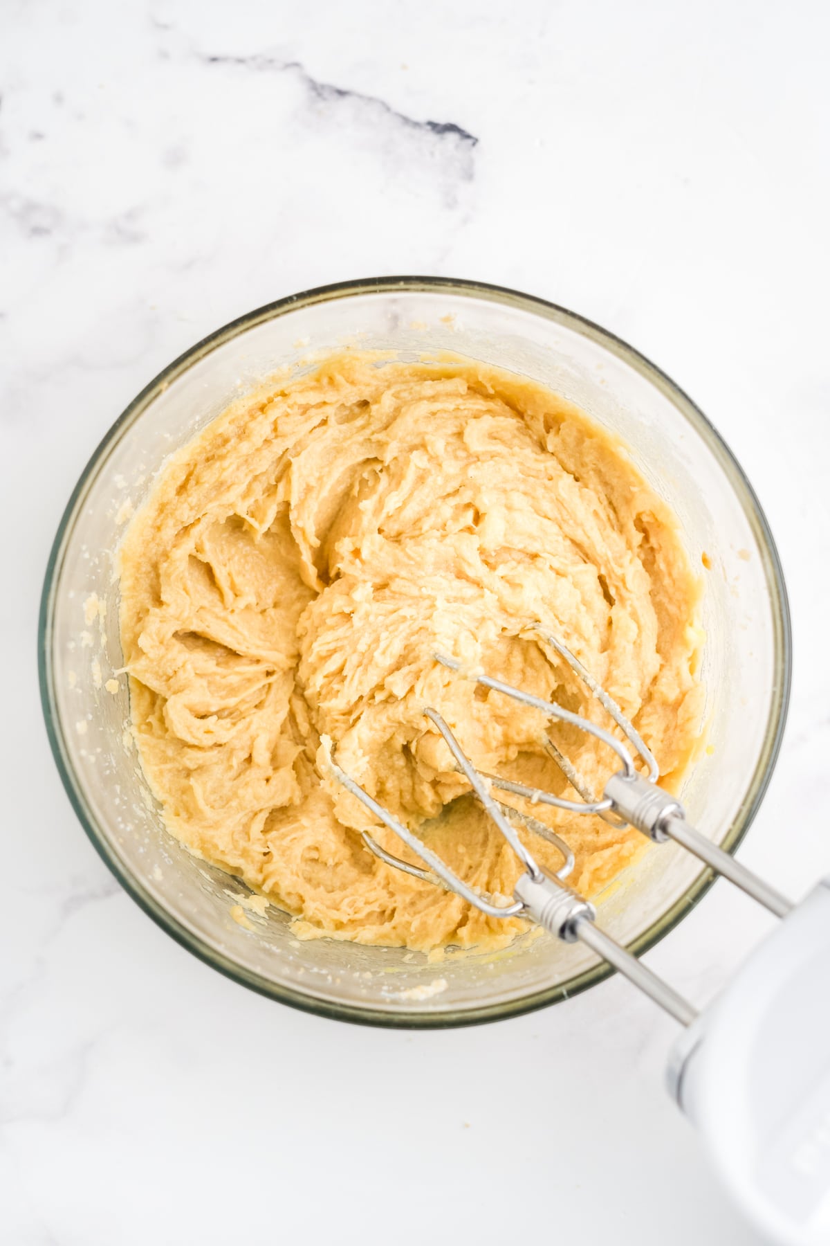 butter and sugar creamed in a mixing bowl