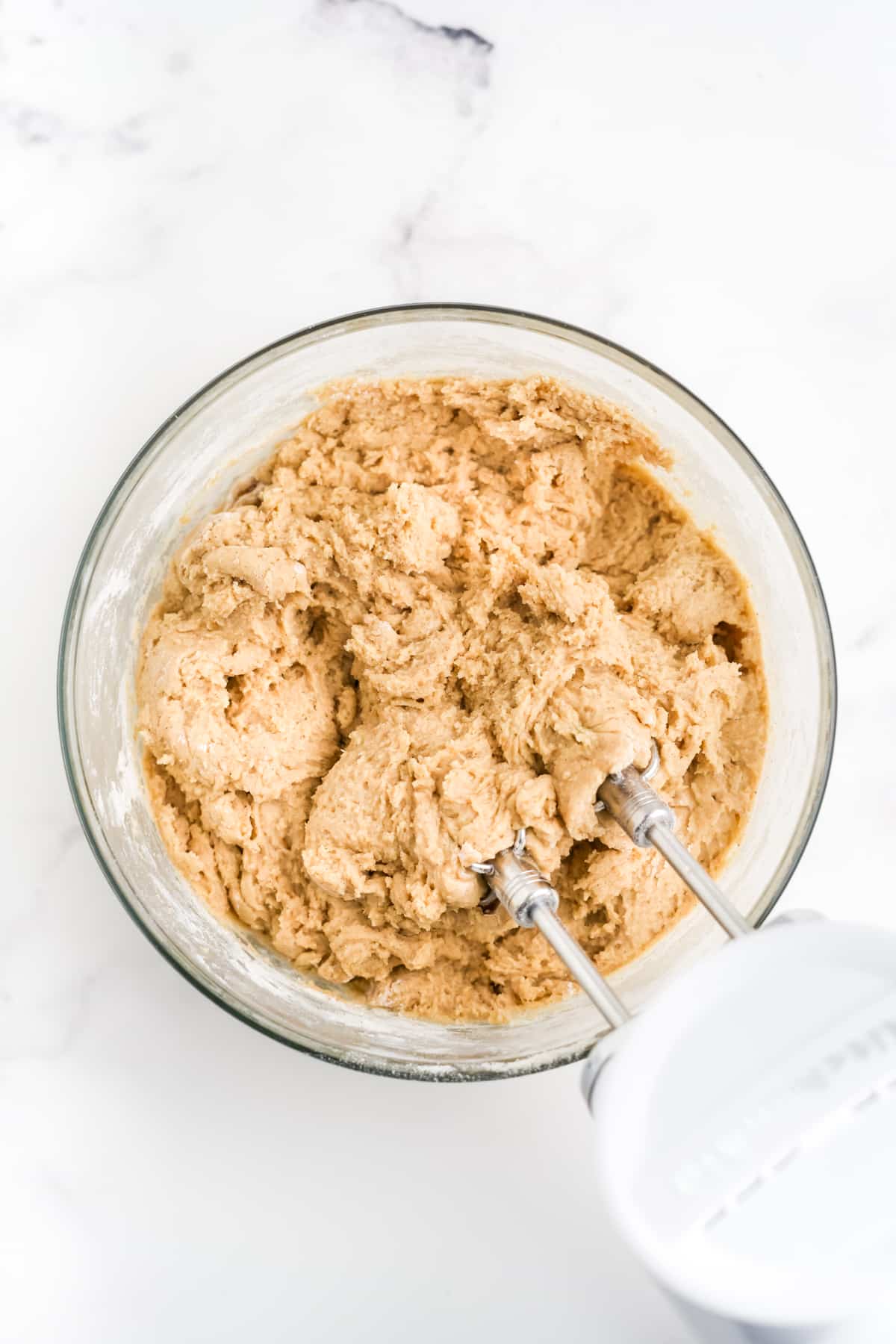 cookie dough being mixed in a bowl