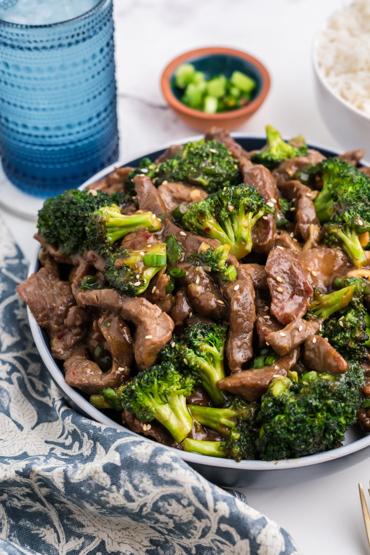 Beef with garlic sauce on a plate.