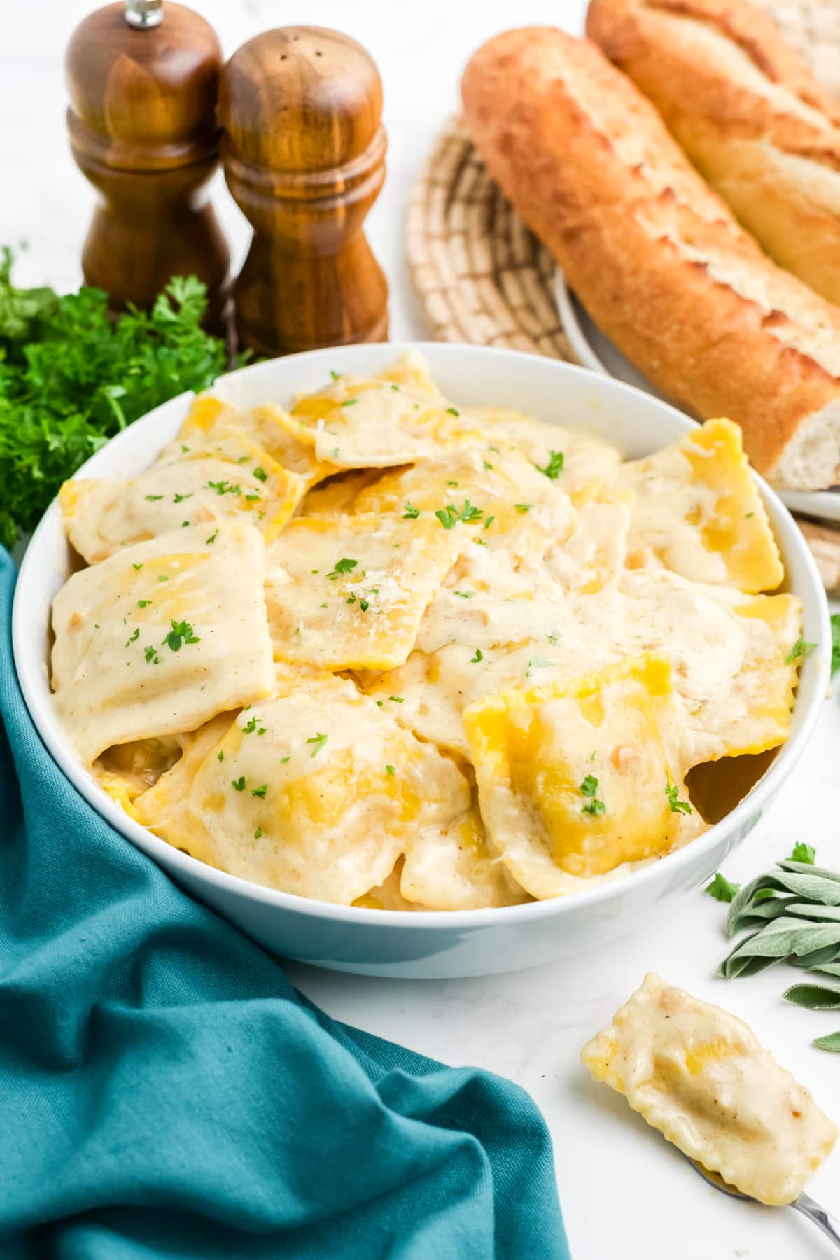 Butternut squash ravioli sauce in a bowl on a table.