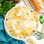 Butternut squash ravioli sauce in a bowl on a table.