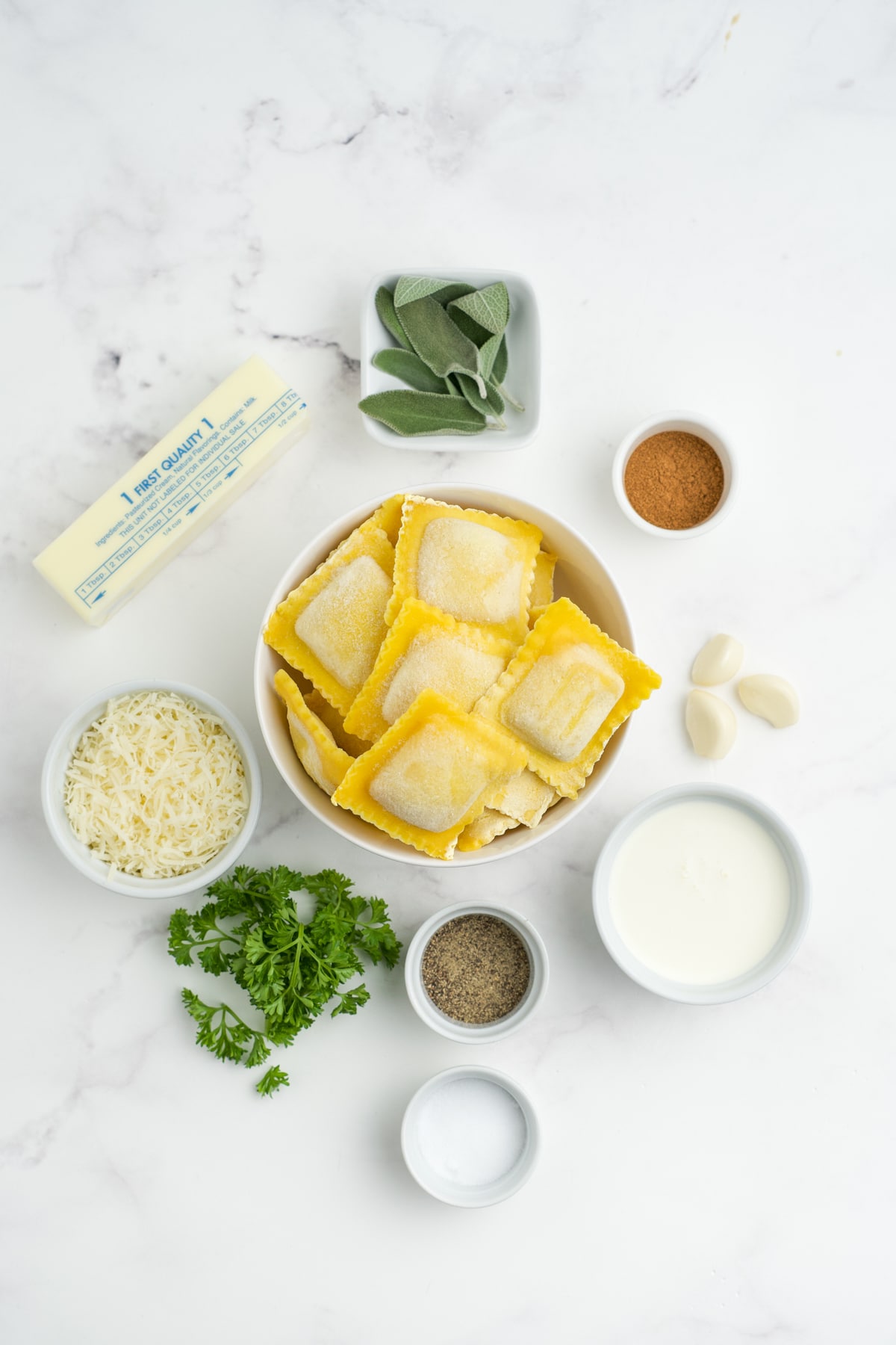 Ingredients to make butternut squash ravioli sauce on the table before preparing. 