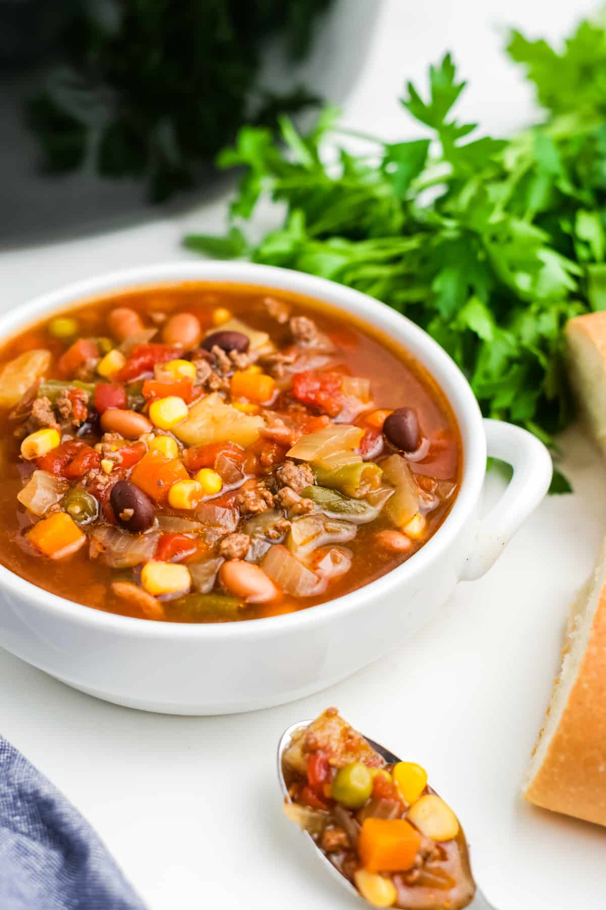 A white bowl filled with crock pot cowboy soup.