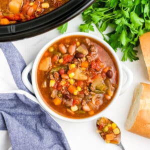 A white bowl filled with crockpot cowboy soup.