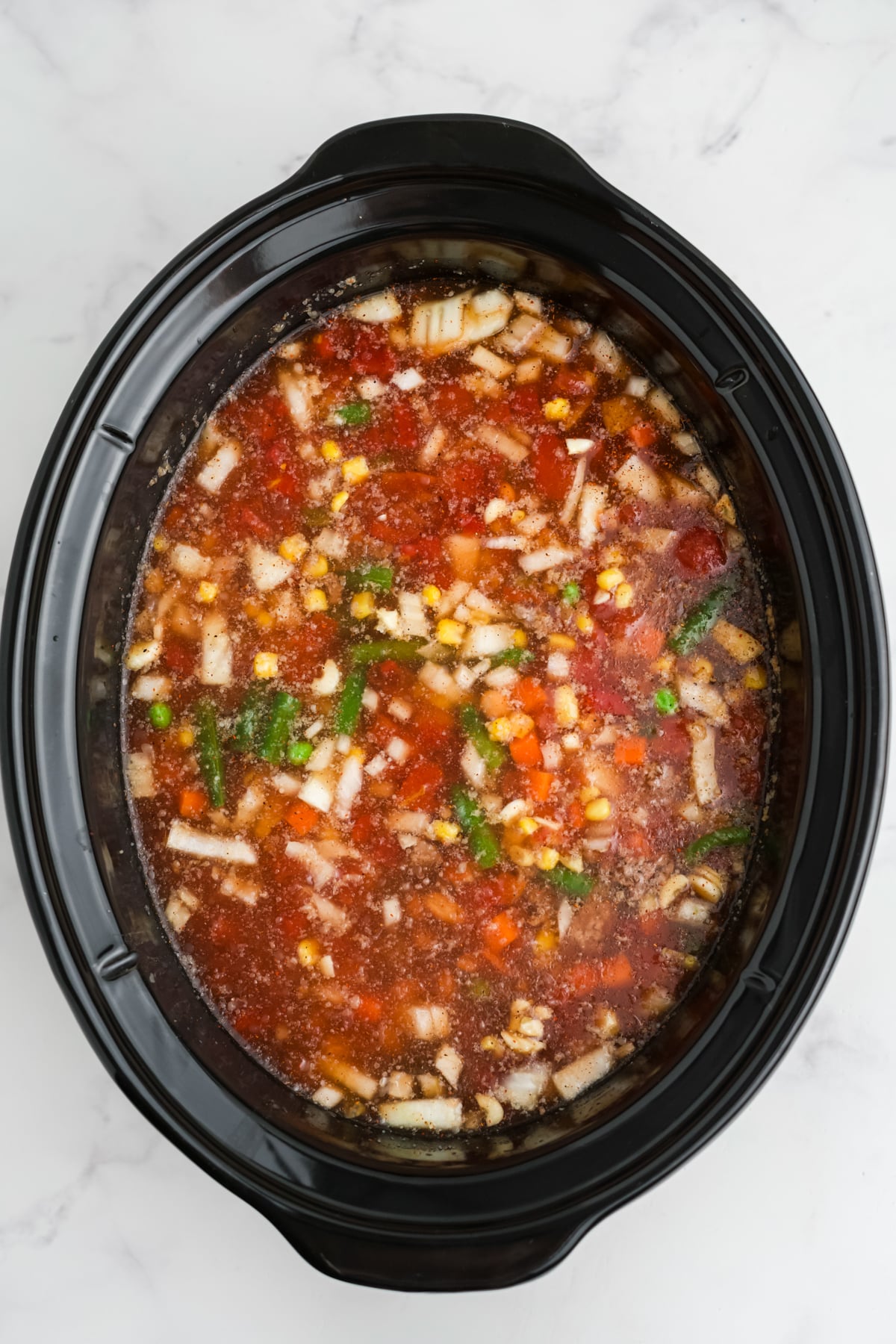 Cooked crock pot cowboy soup in the slow cooker.