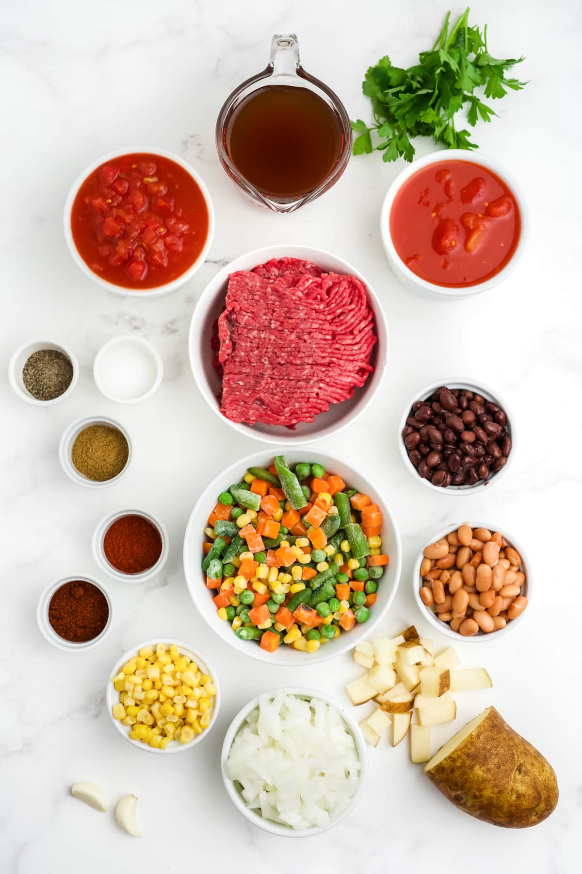 Ingredients for making crock pot cowboy soup in bowls.