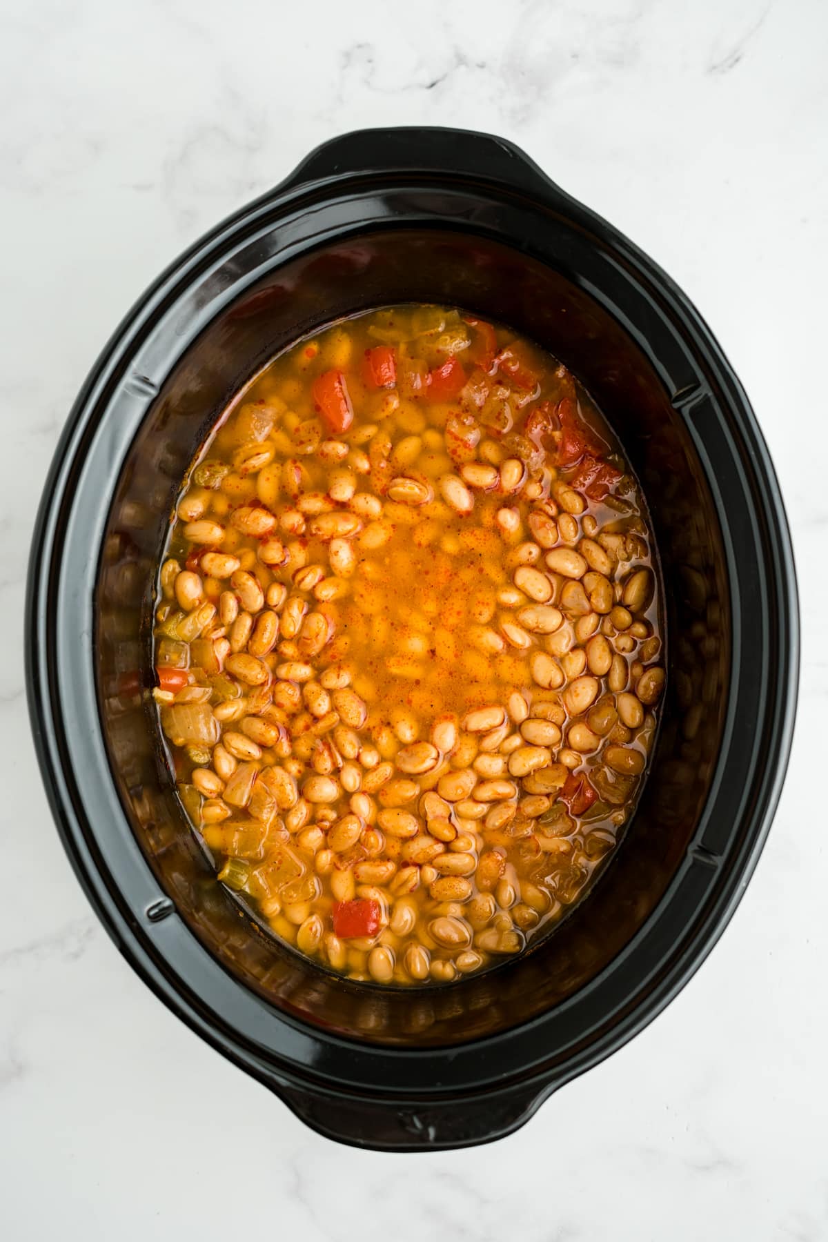 Cooked buffalo chicken chili in the slow cooker.