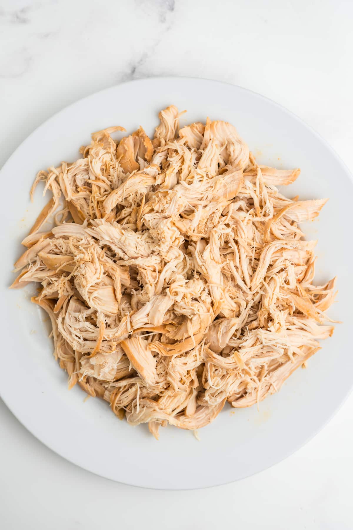Shredded chicken on a plate.