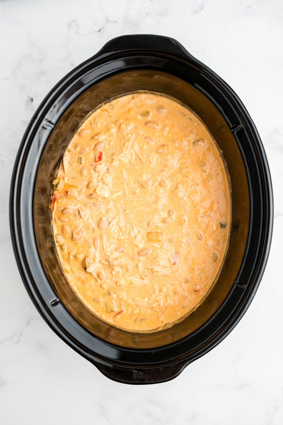 Cooked slow cooker buffalo chicken chili in the slow cooker.