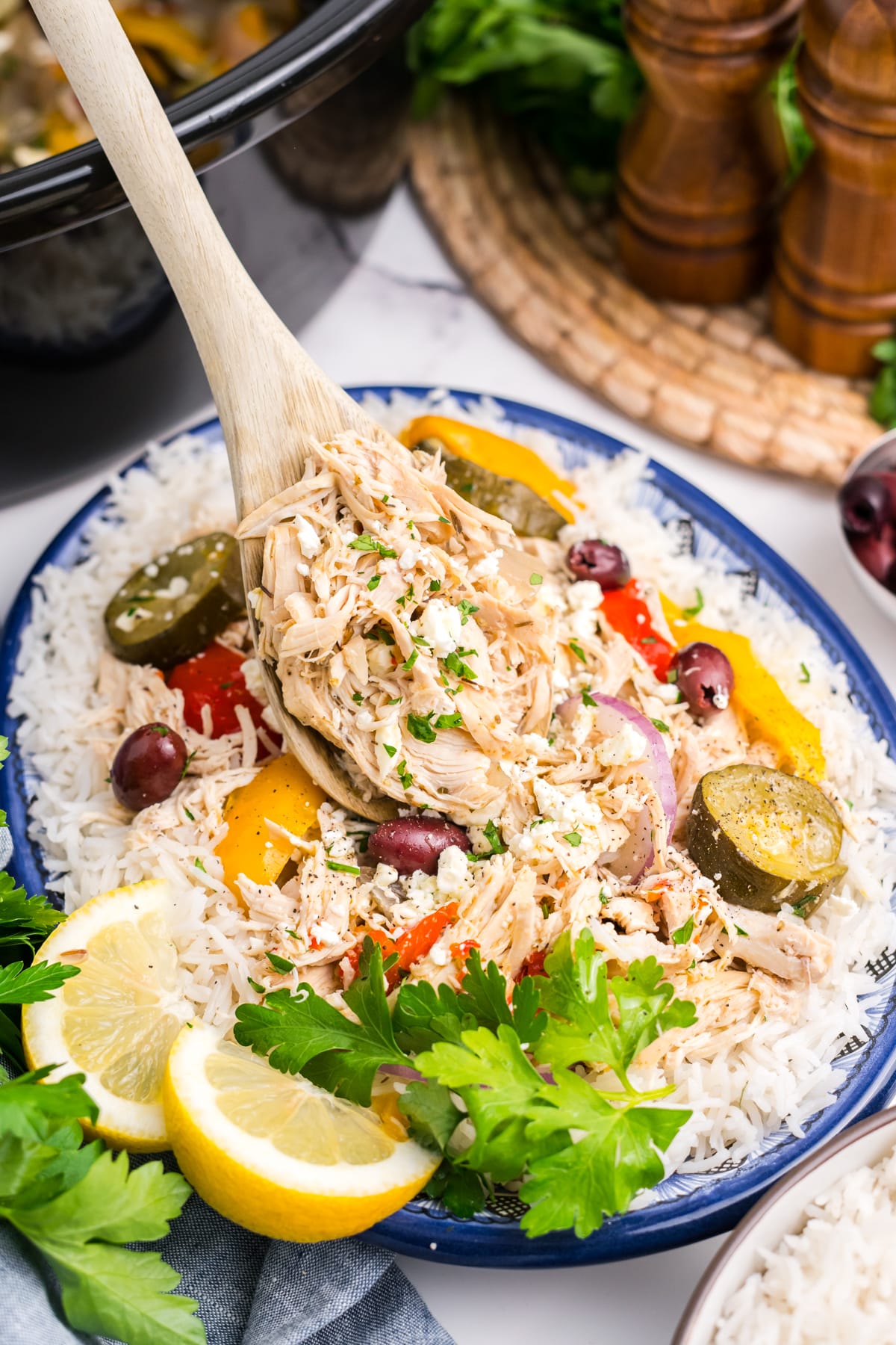 Slow cooker Greek chicken in a serving dish.