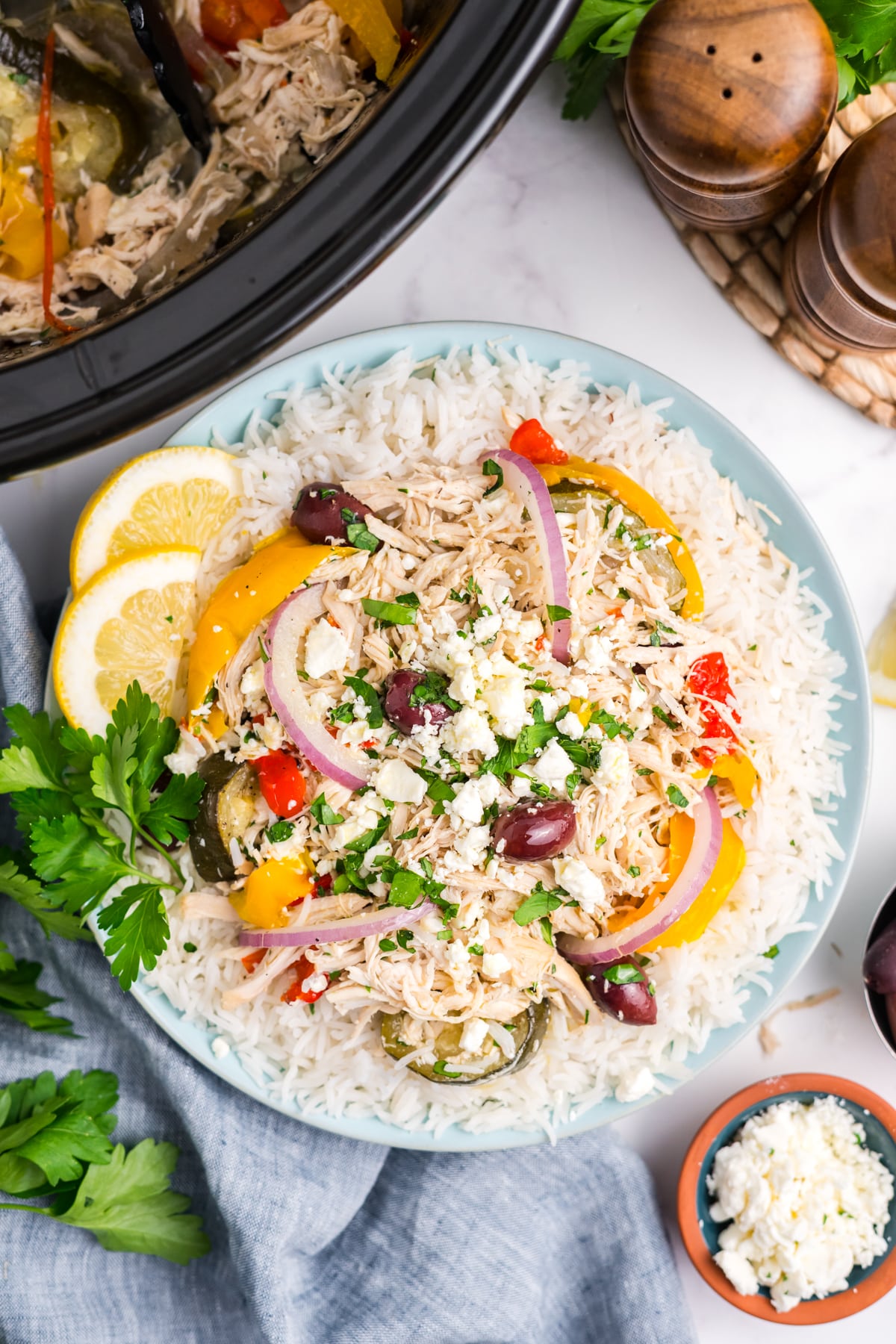 Slow cooker Greek chicken in a serving dish.