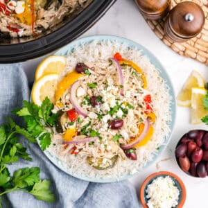 Crockpot Greek chicken in a serving dish.
