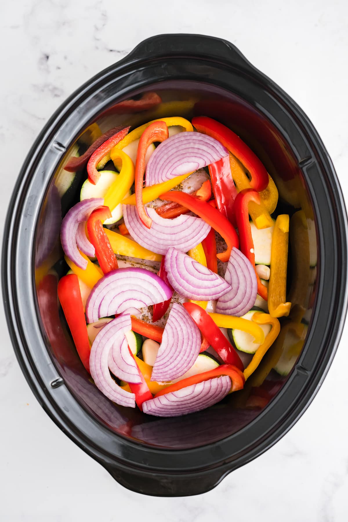 Chicken and veggies in the slow cooker.