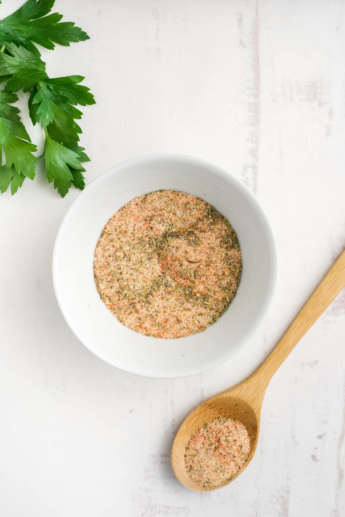 Turkey leg seasonings mixed together in a white bowl.