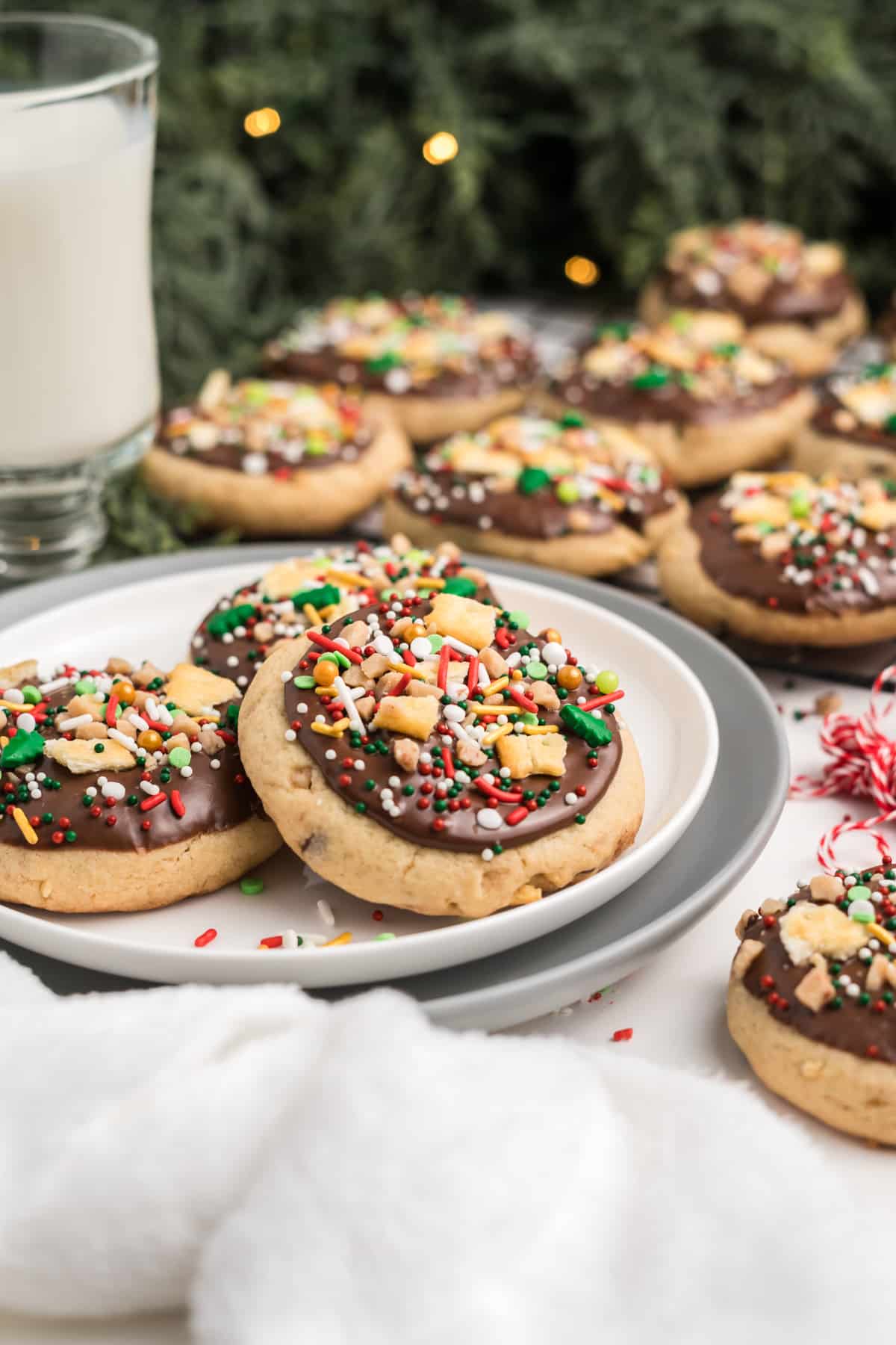 Three Christmas crack cookies on a plate.