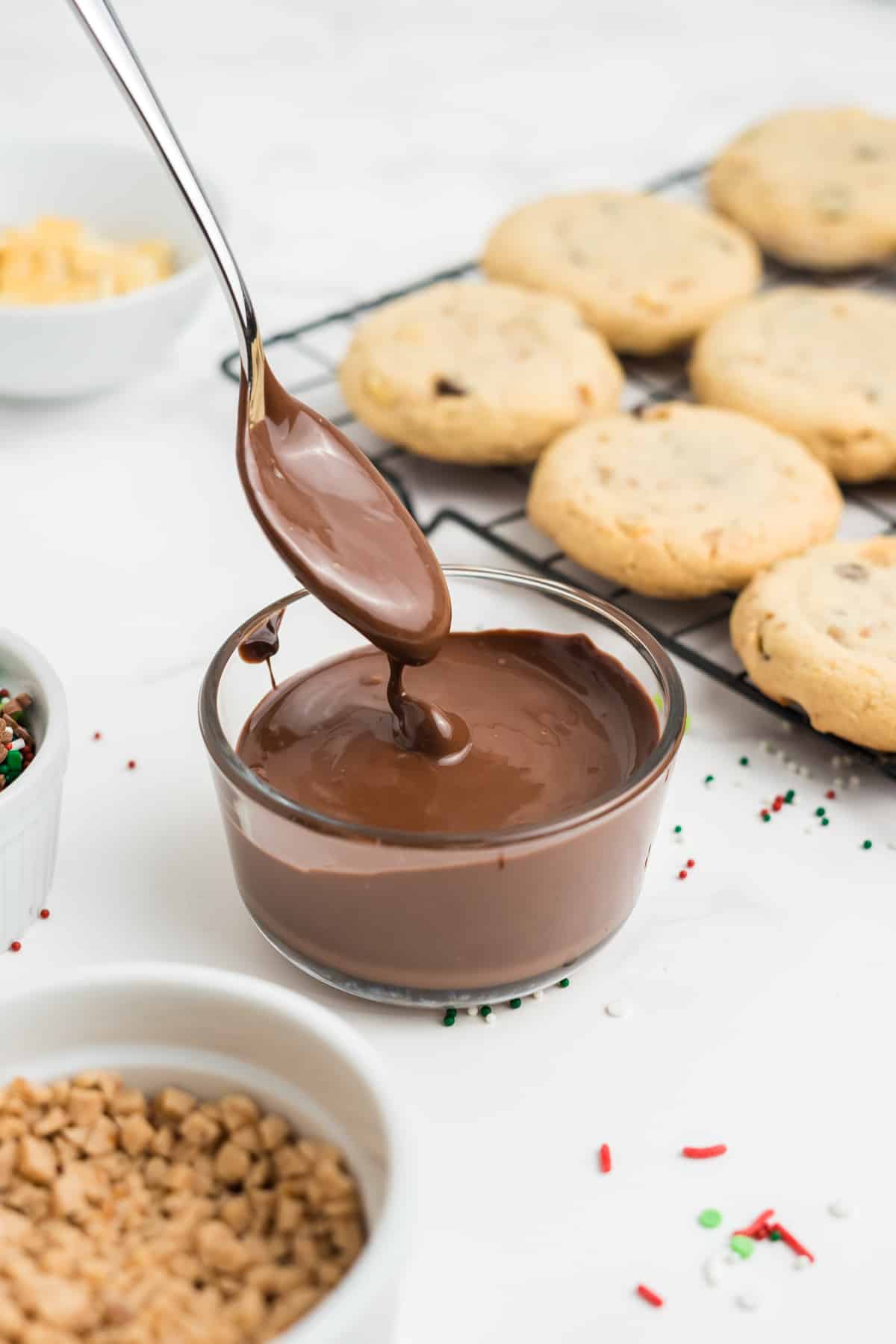 Melted chocolate in a small glass bowl.