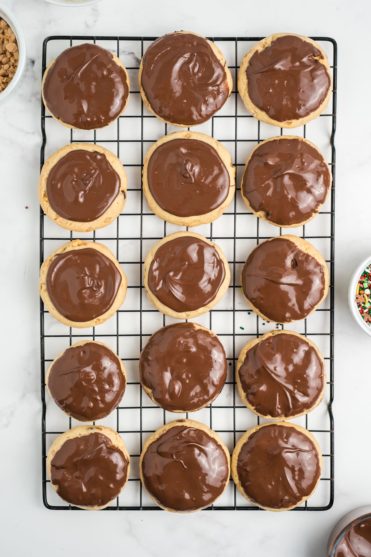 Melted chocolate on top of baked cookies.