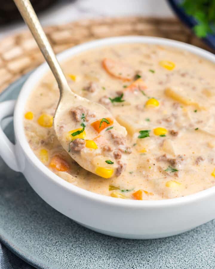 A bowl of crockpot creamy hamburger and potato soup.