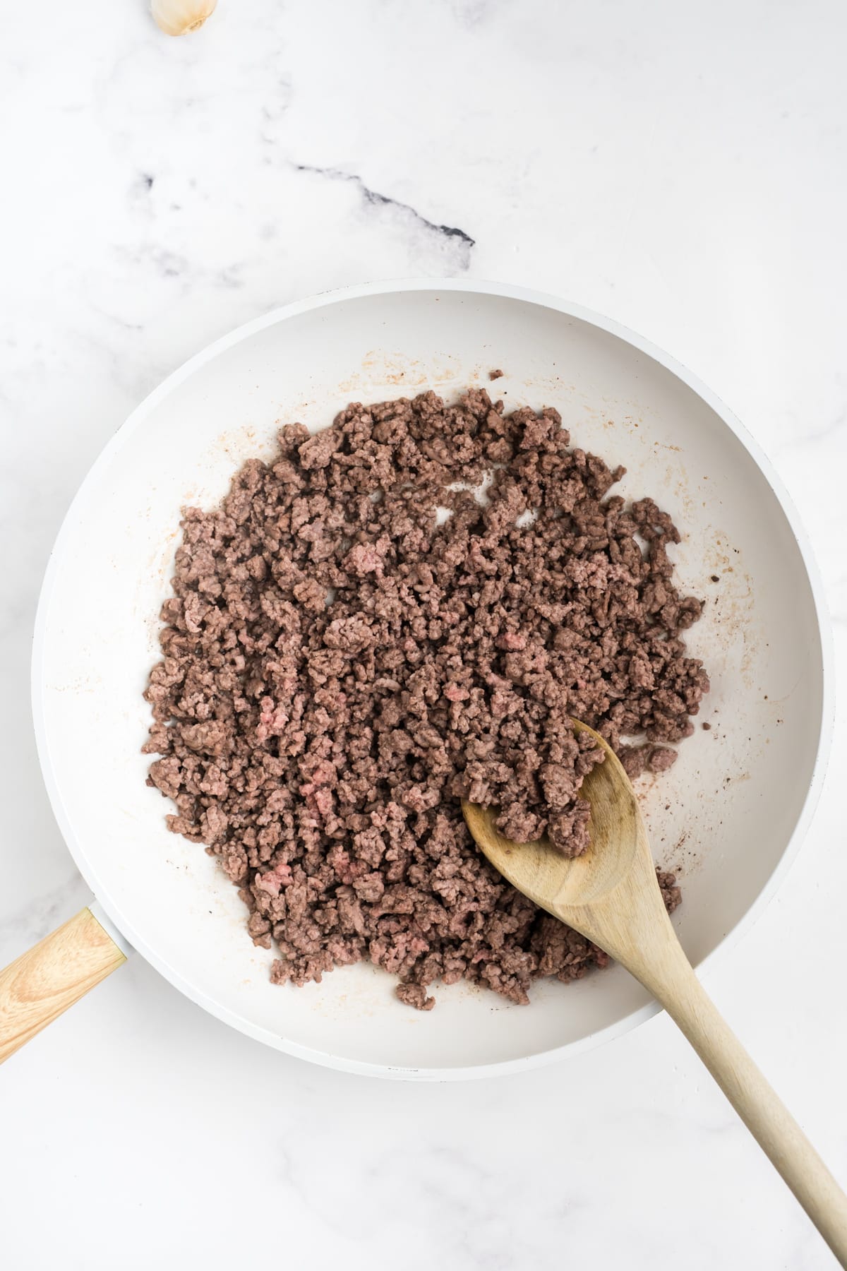 Ground beef in a skillet.