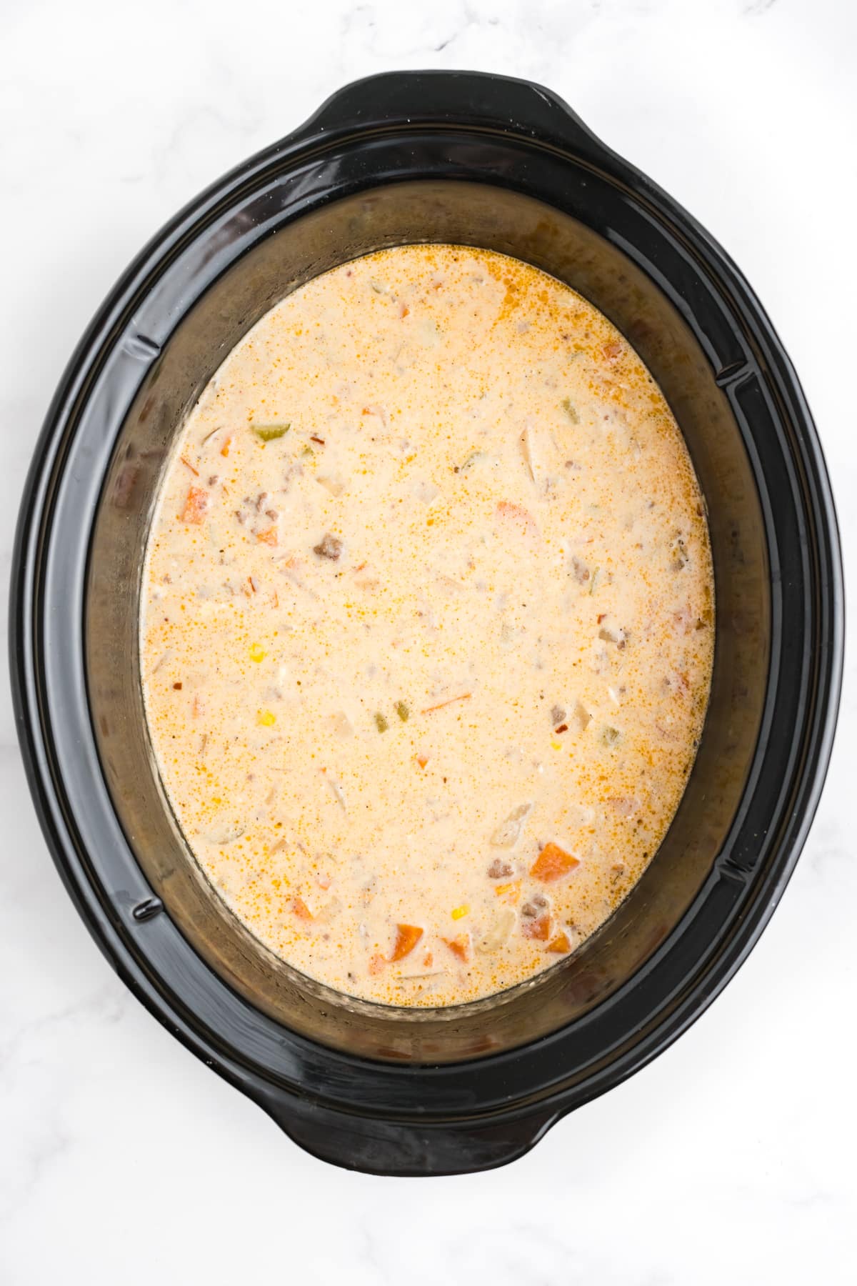 Creamy hamburger and potato soup cooked in the slow cooker.