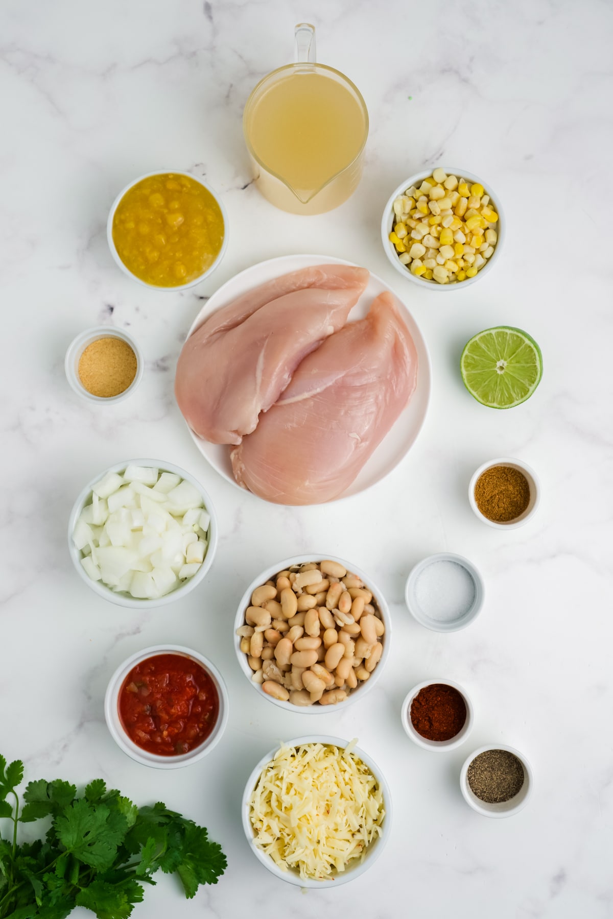 Ingredients for making white chicken chili in bowls.