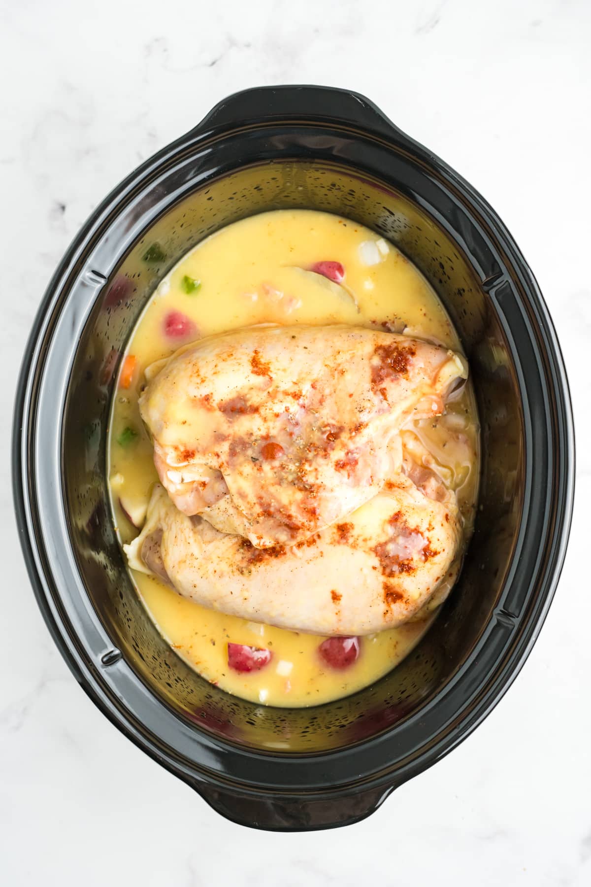 Sauce added to the slow cooker over the chicken and vegetables. 