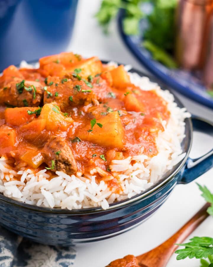 Hawaiian beef stew in a bowl over rice.