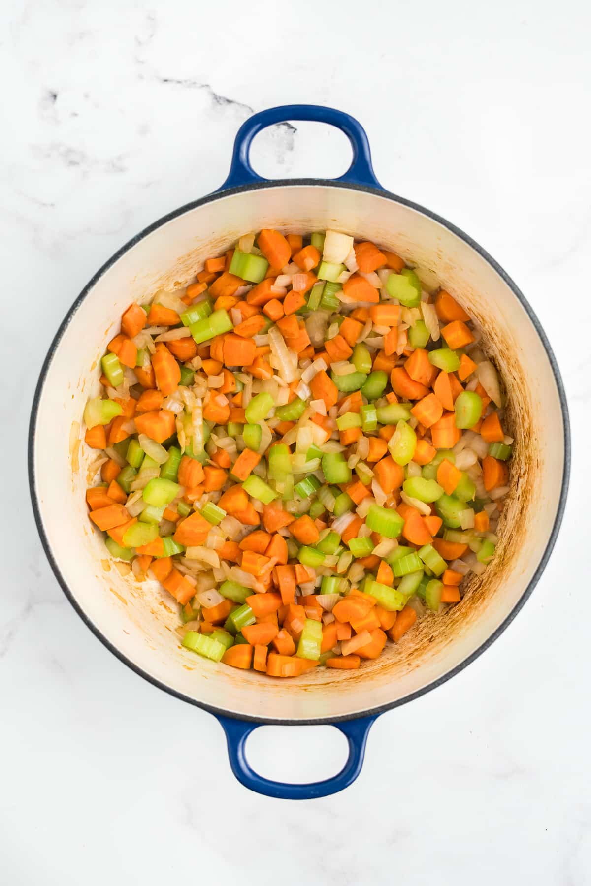 Chopped veggies being cooked in a pot.