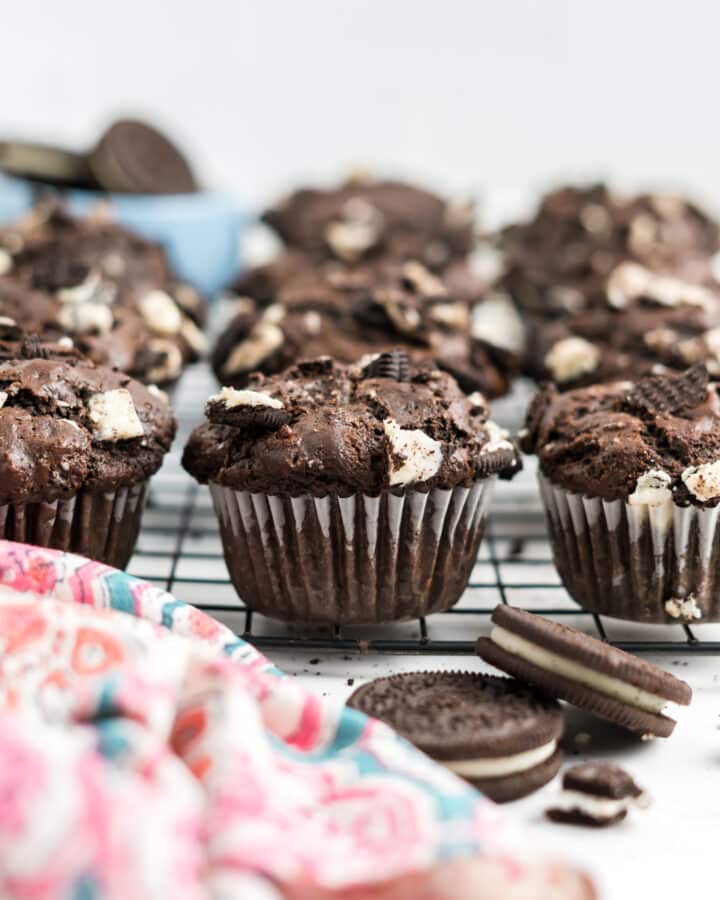 Oreo muffins on a cooling rack.