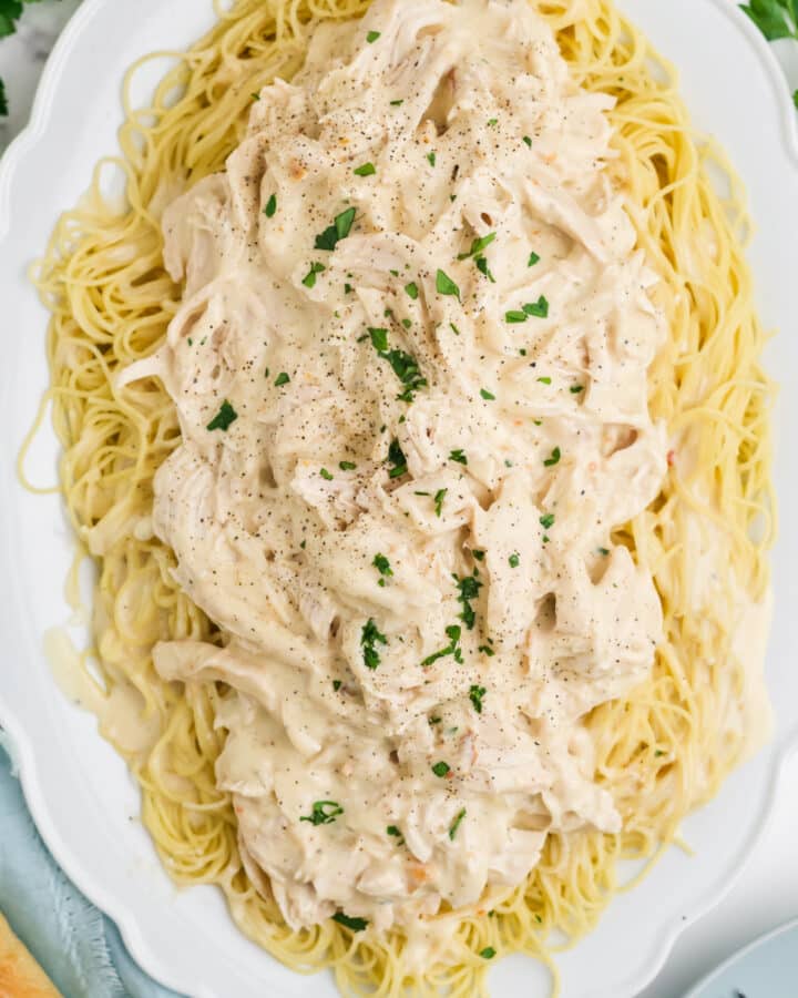 An overhead image of Angel Chicken on a platter over noodles.