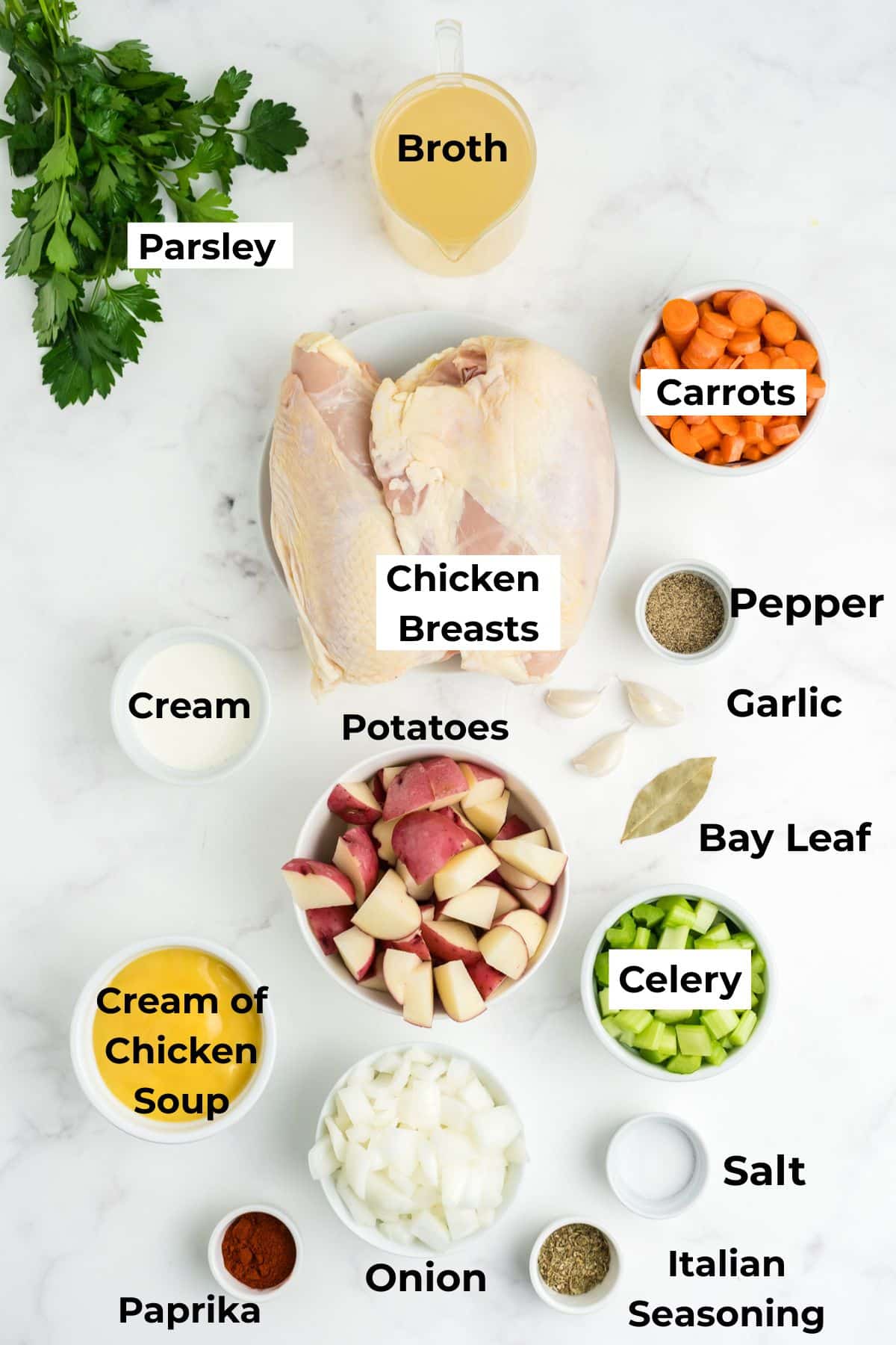 Ingredients to make creamy chicken stew in the slow cooker in bowls on the table. 