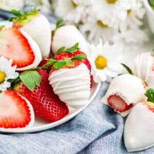 white chocolate covered strawberries on a white plate