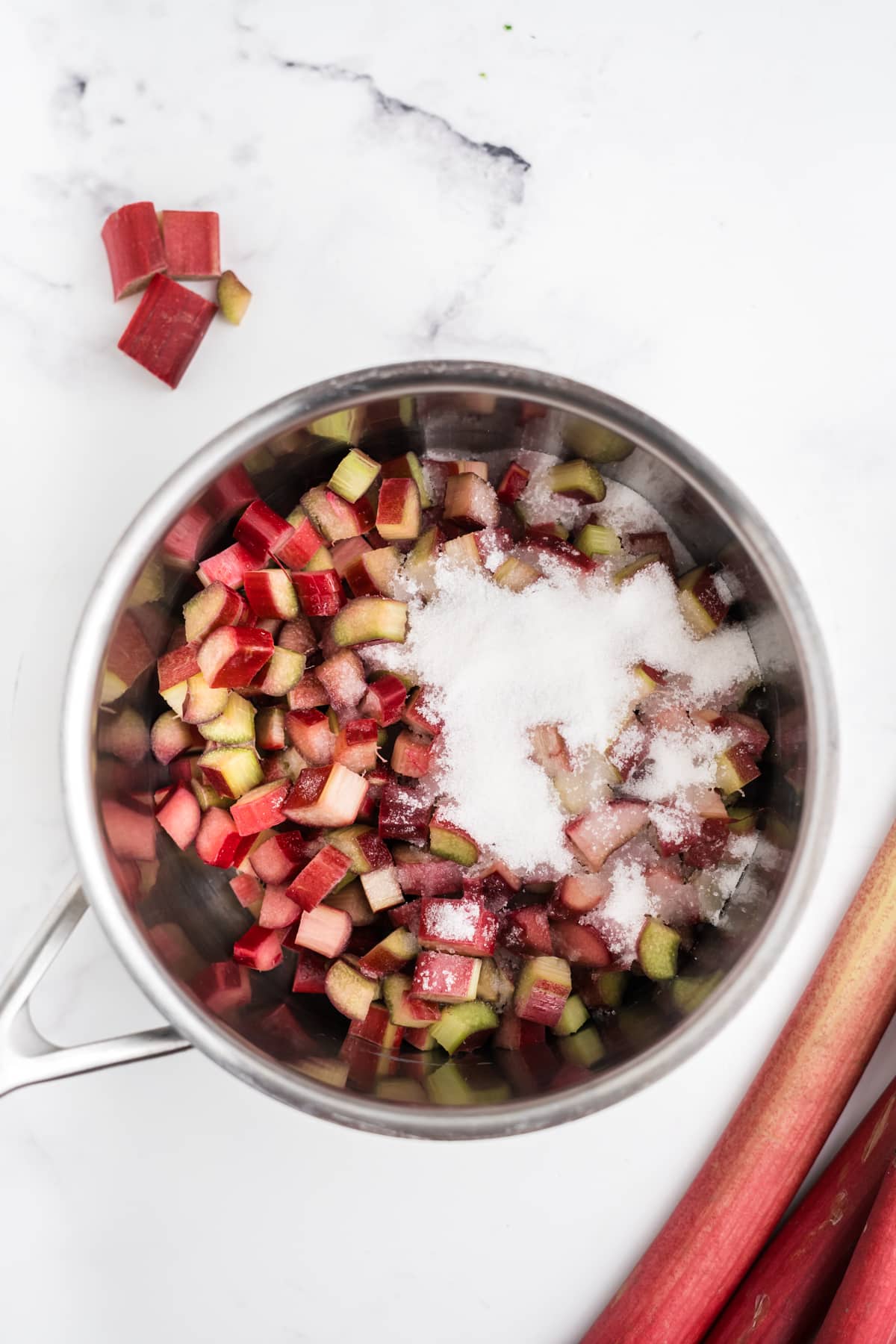 Rhubarb and sugar in a saucepan.