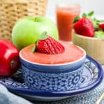 Strawberry applesauce in a blue and white bowl.