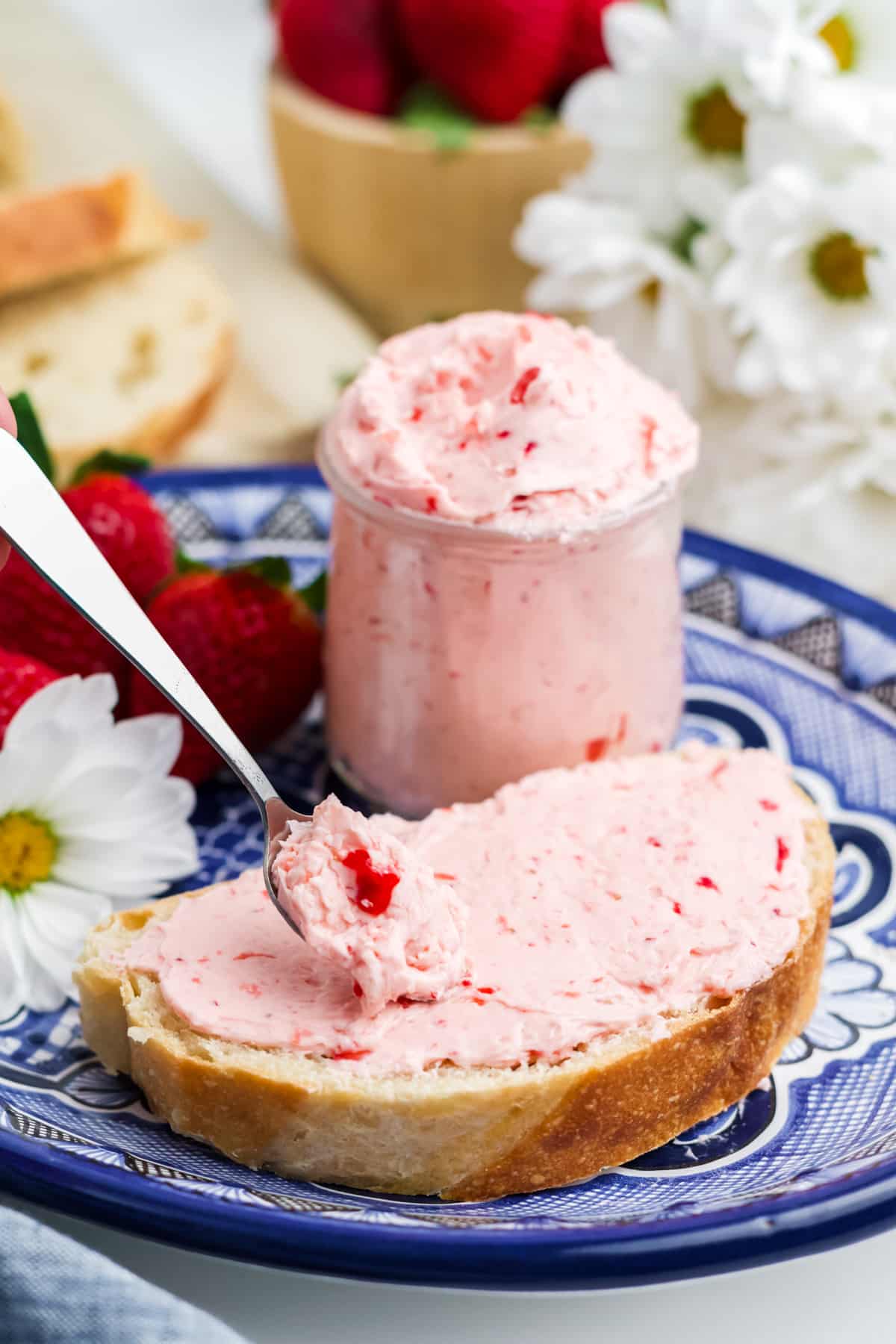 Strawberry butter in a jar and spread on bread.
