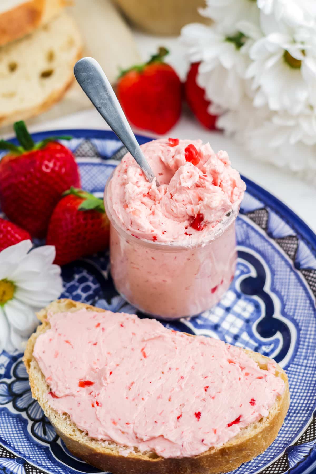 Strawberry butter in a jar and spread on bread.