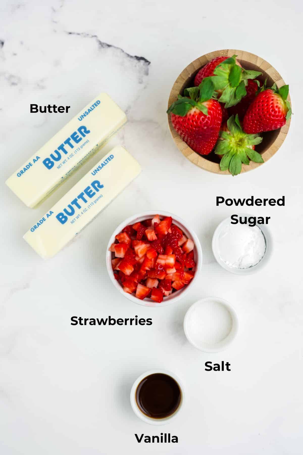 Ingredients for making strawberry butter in bowls.
