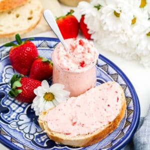 Strawberry butter in a jar and spread on bread.